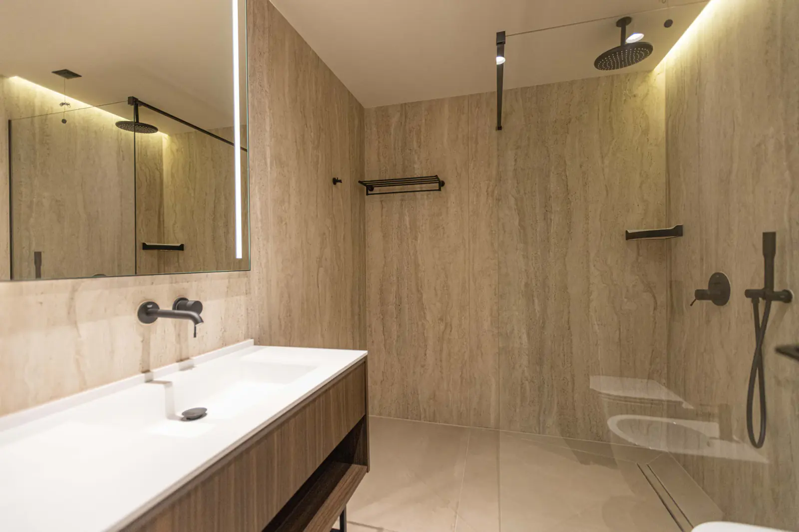 Rain shower and stone bathroom at Quartz Hotel